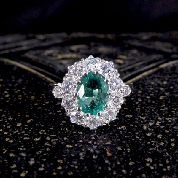 Contemporary 1ct Emerald and 0.95ct Diamond Cluster Ring