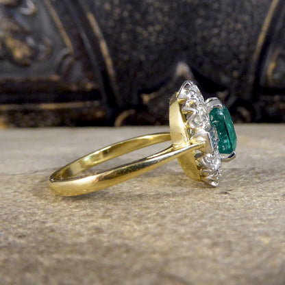 Contemporary 2.08ct Emerald and 1.25ct Diamond Cluster Ring