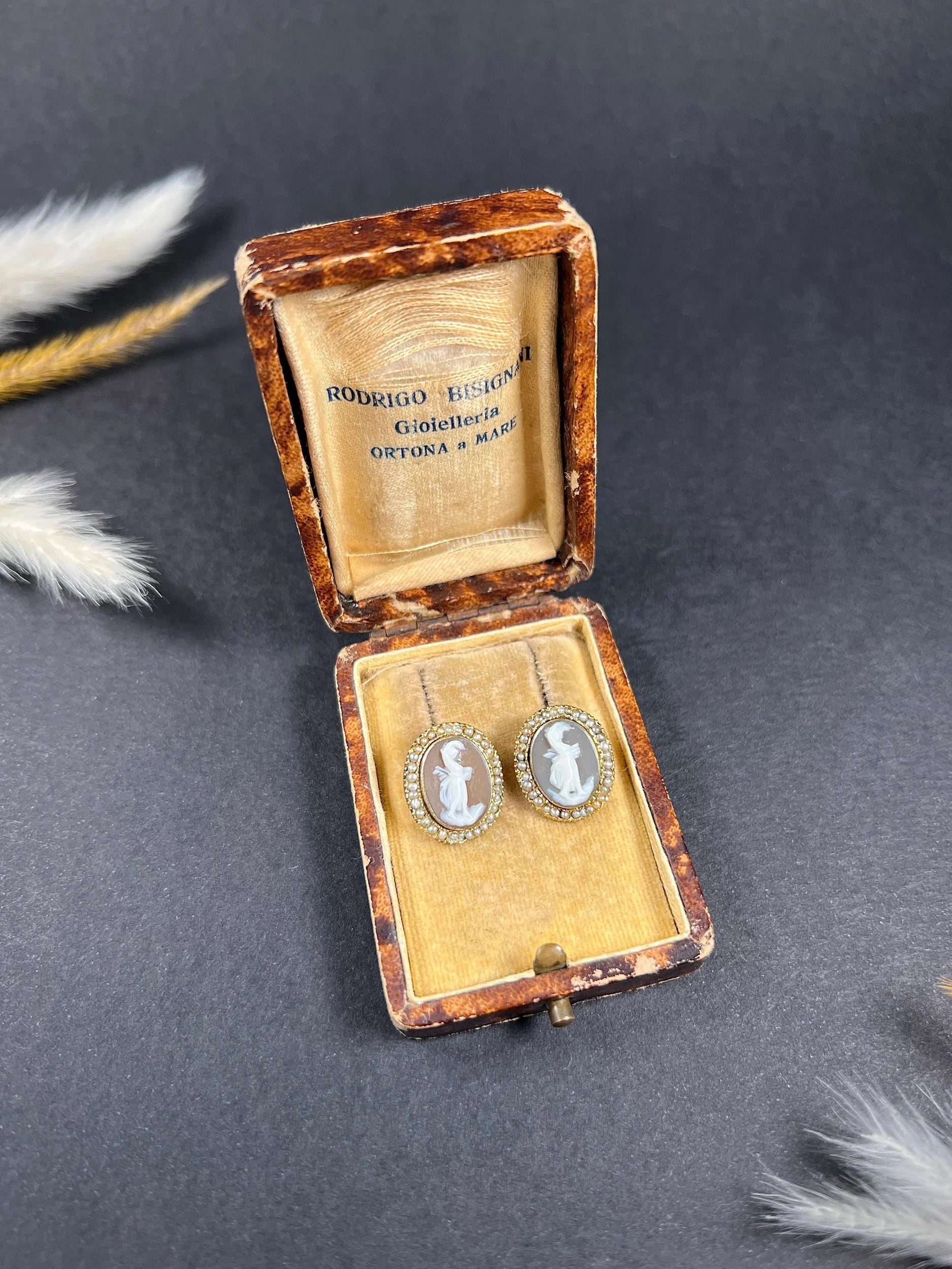 A pair of yellow gold oval shell cameo earrings, in an antique box