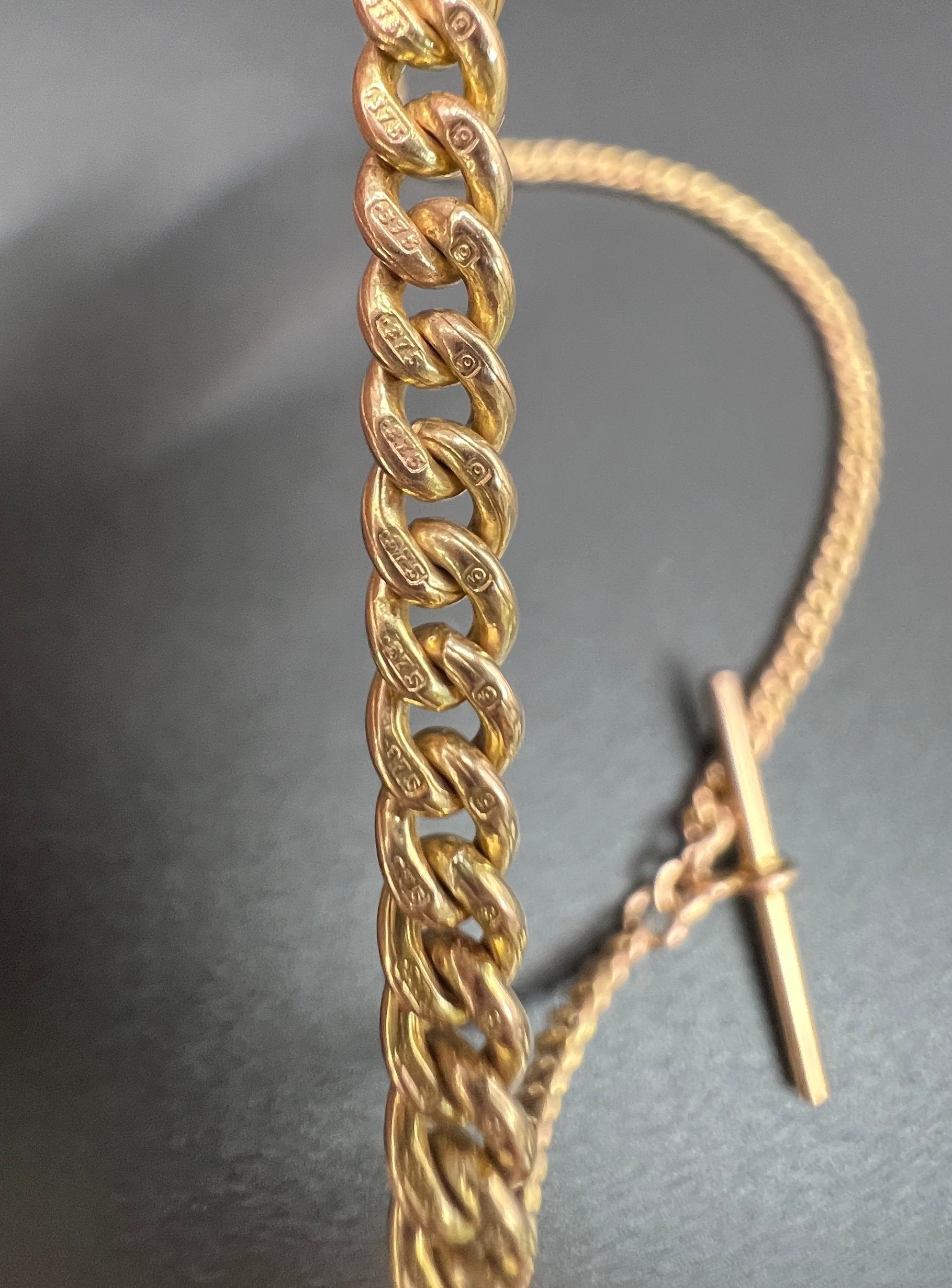 A yellow gold curb link Albert watch chain