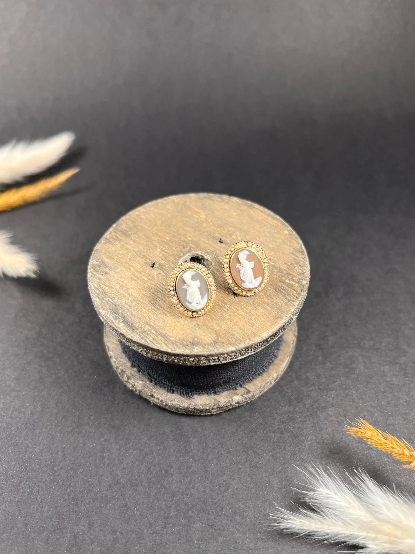 A pair of yellow gold oval shell cameo earrings