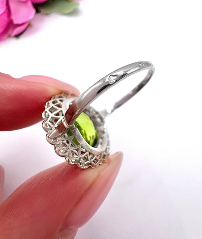 Antique French Platinum Peridot and Diamond Halo Cluster Ring, Circa 1910