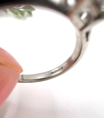 Close-up of hallmarks inside a platinum ring shank