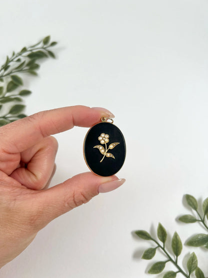 Edwardian 18 Carat Yellow Gold Onyx and Seed Pearl Flower Locket, Circa 1900