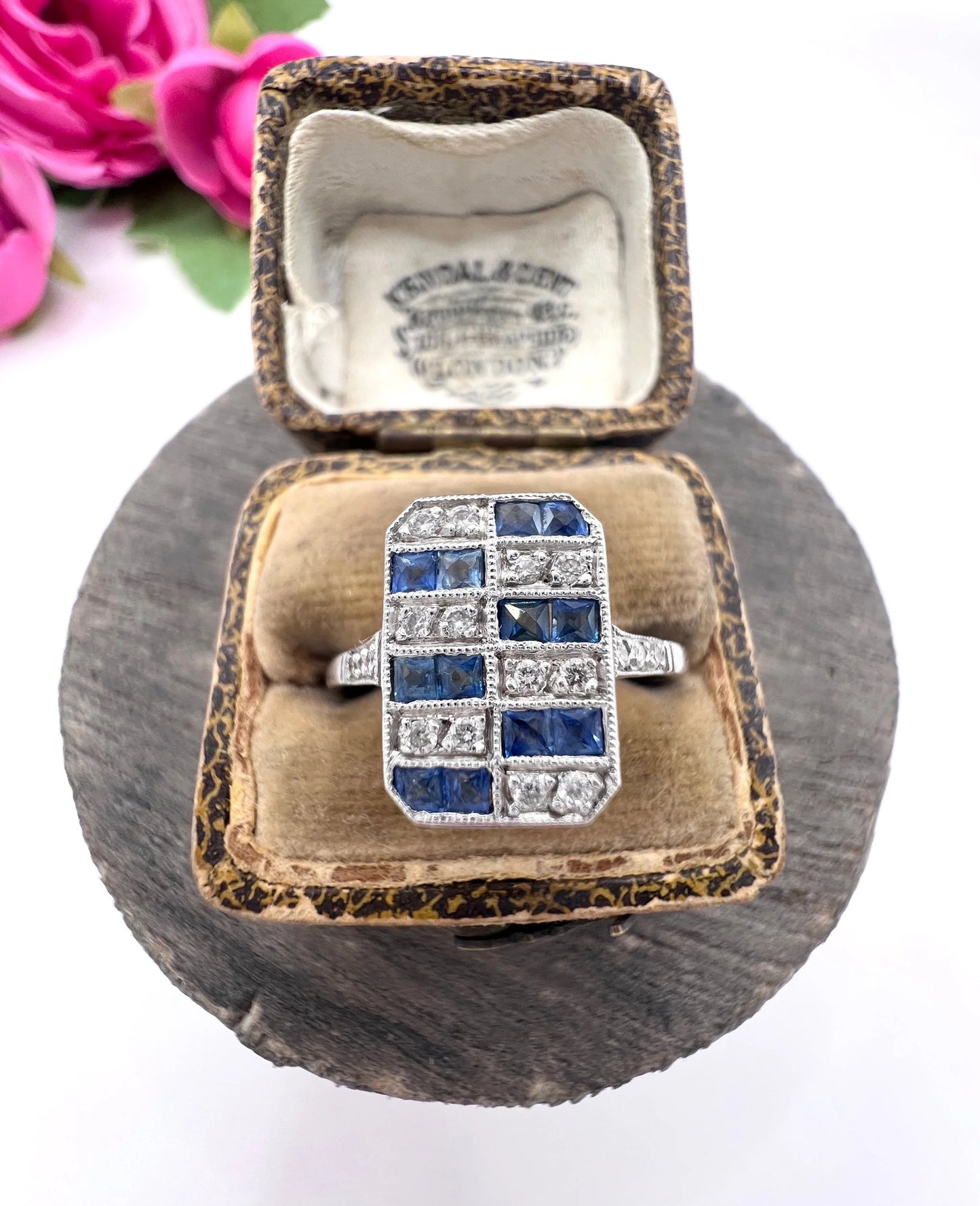 A sapphire and diamond tablet style ring in platinum, in an antique ring box
