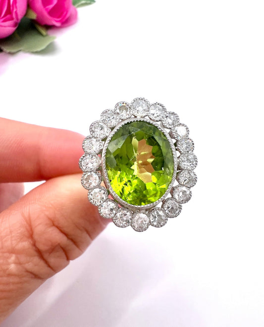 Antique French Platinum Peridot and Diamond Halo Cluster Ring, Circa 1910