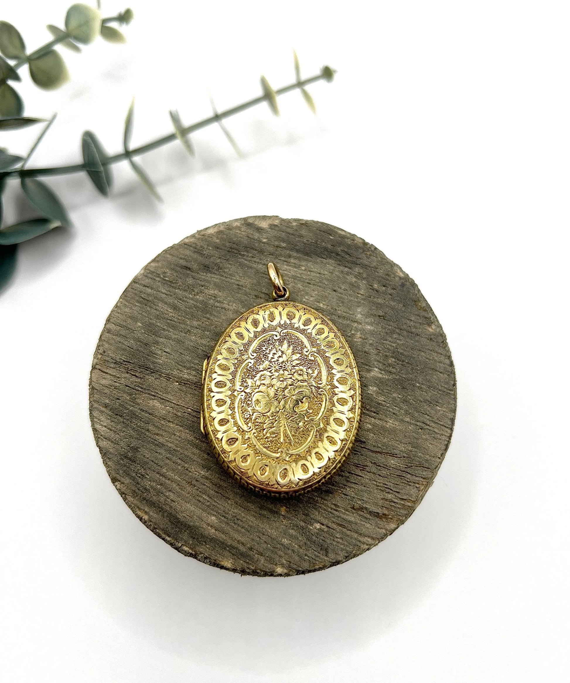 Early Victorian 15 Carat Yellow Gold Floral Engraved Oval Shaped Locket, Circa 1860