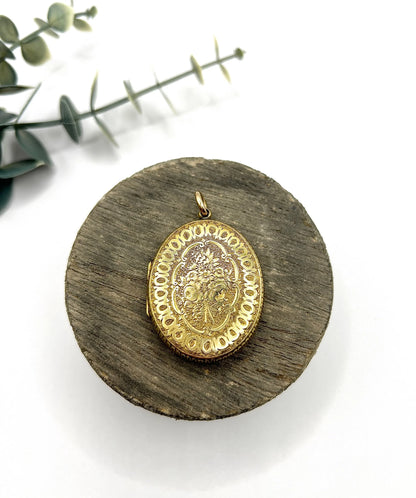 Early Victorian 15 Carat Yellow Gold Floral Engraved Oval Shaped Locket, Circa 1860