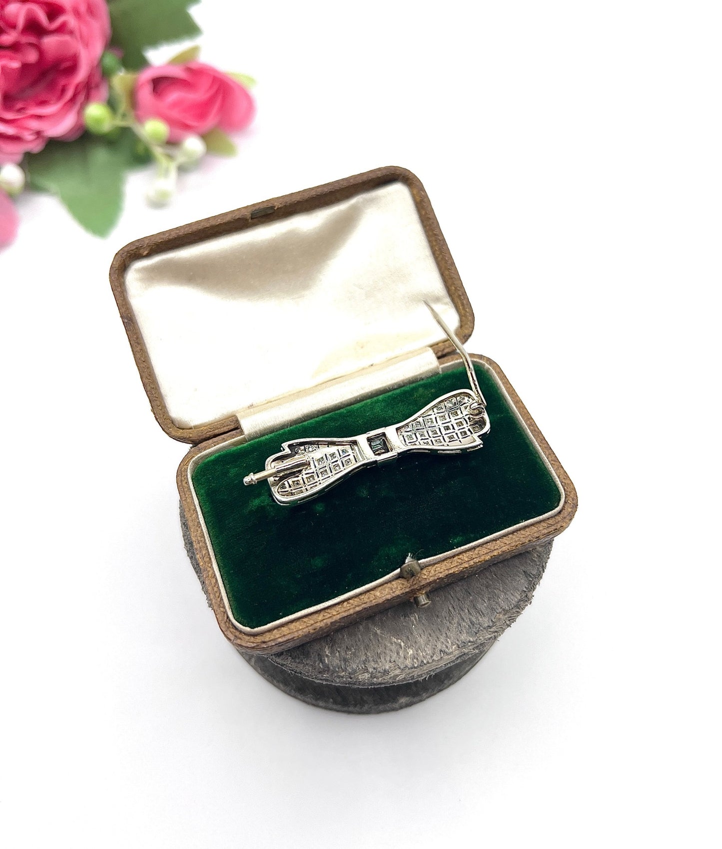 Art Deco 14 Carat White Gold Onyx and Diamond Bow Brooch, Circa 1920