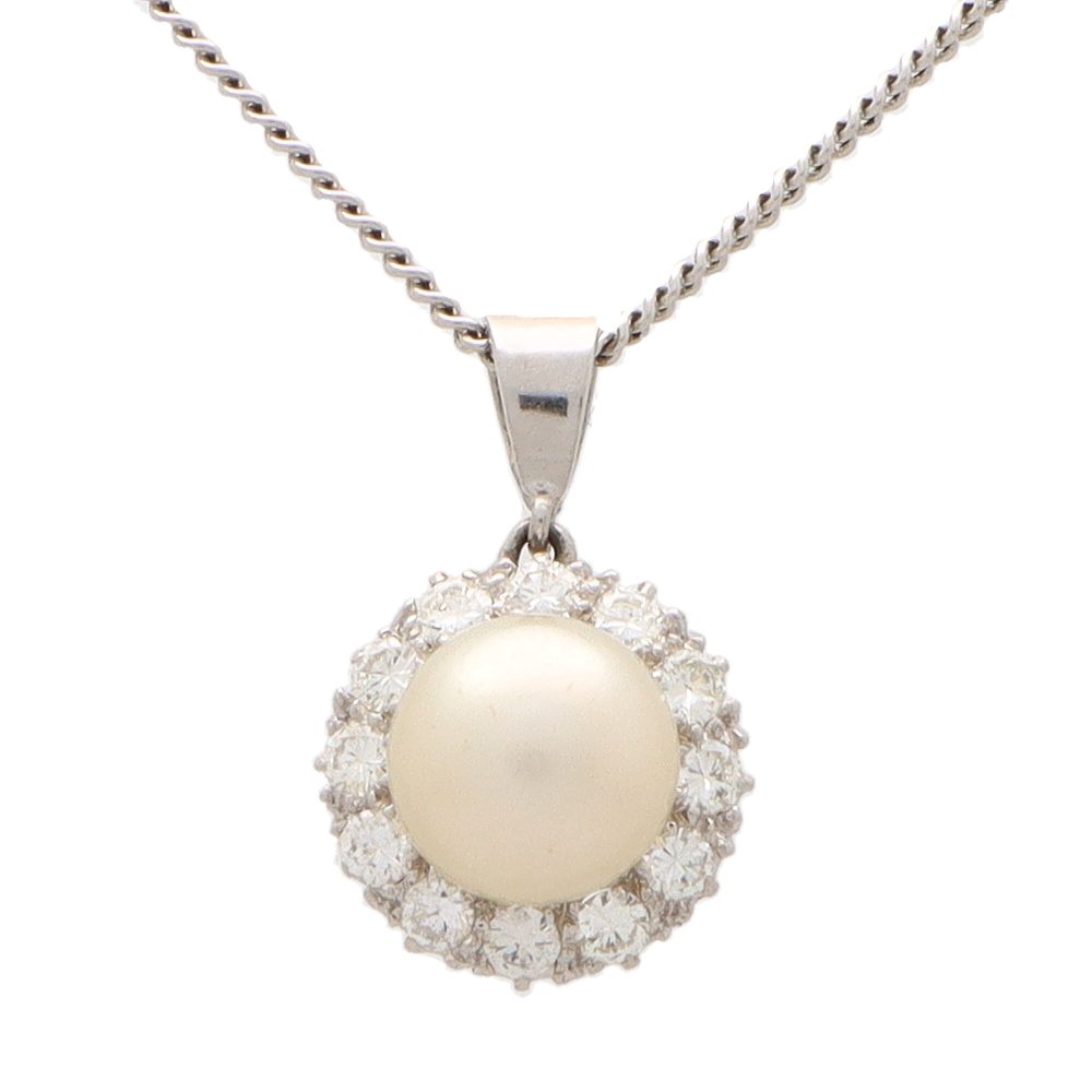Diamond and pearl pendant necklace set in 9 carat white gold.