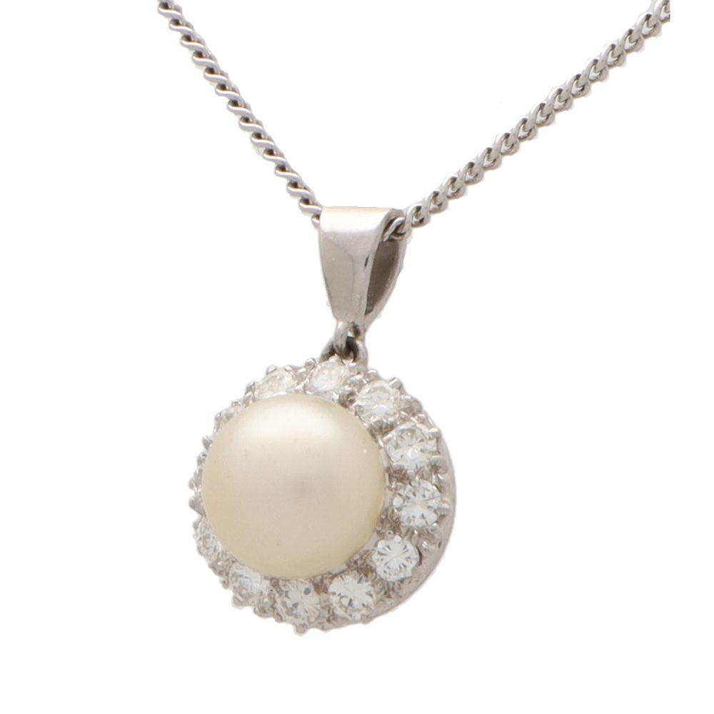 Diamond and pearl pendant necklace set in 9 carat white gold.