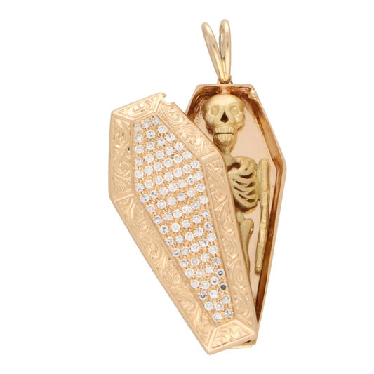 Vintage diamond skeleton and coffin pendant in rose and yellow gold.