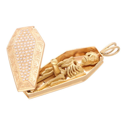 Vintage diamond skeleton and coffin pendant in rose and yellow gold.