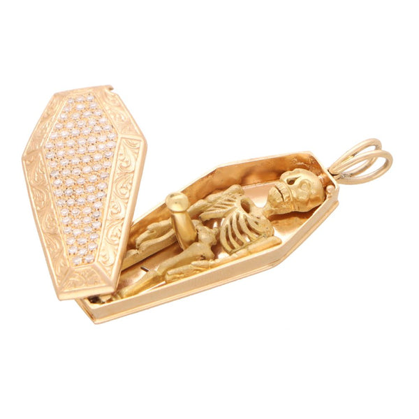 Vintage diamond skeleton and coffin pendant in rose and yellow gold.