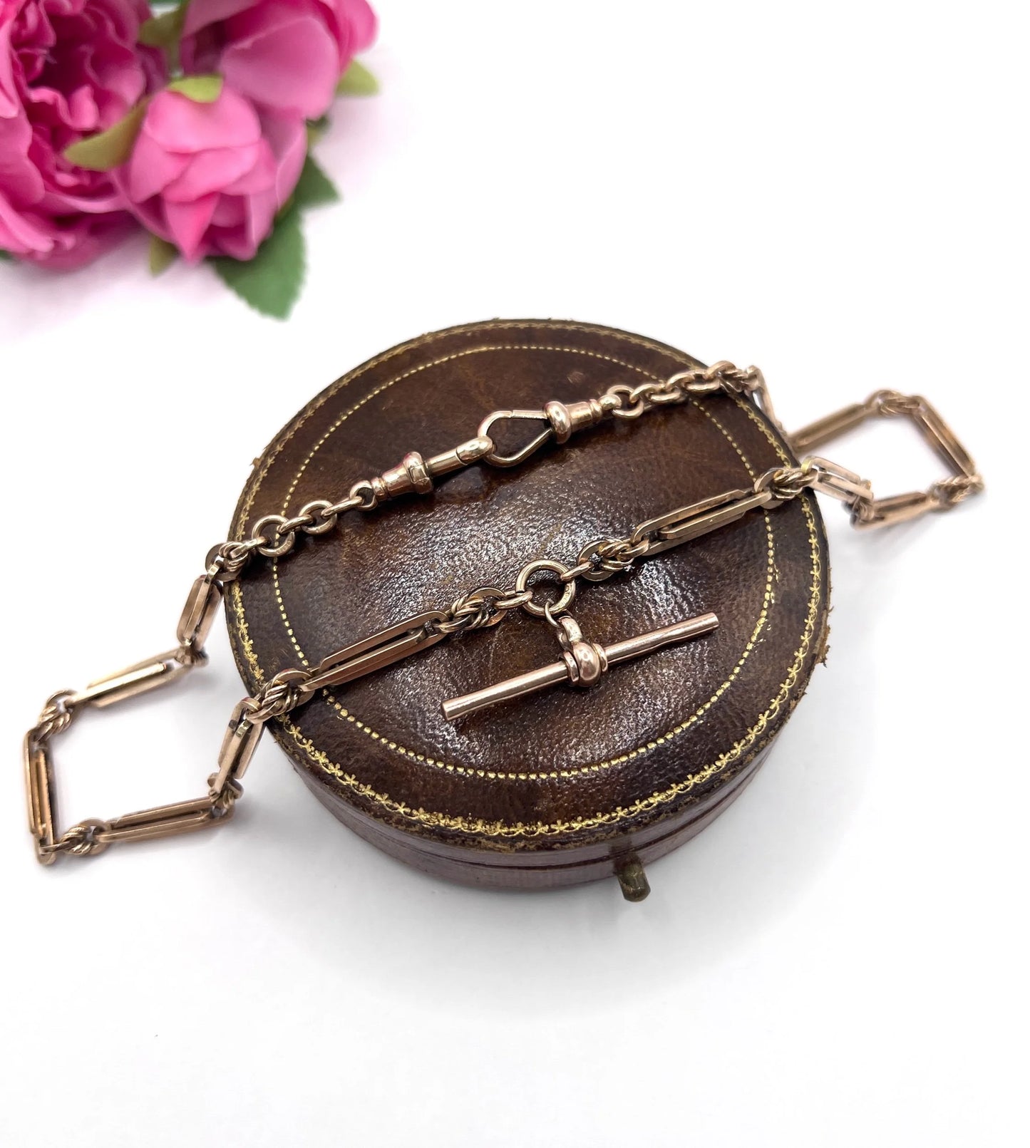 A rose gold fancy link Albert chain necklace