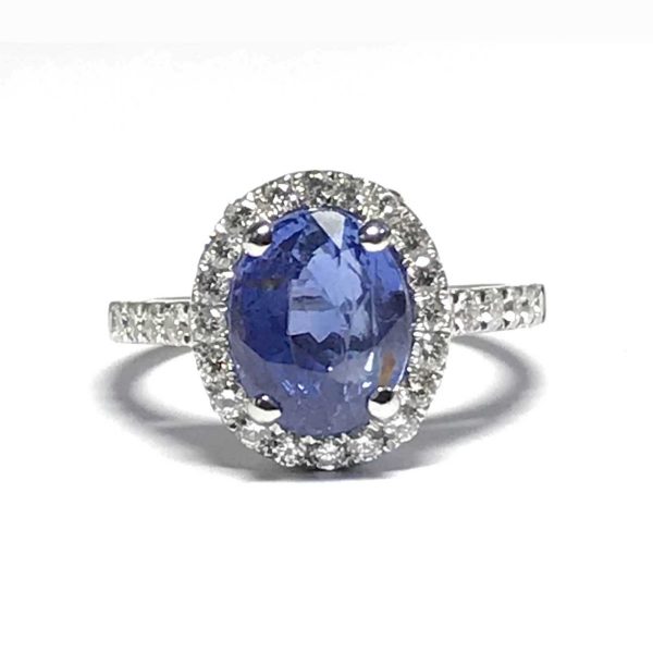 Sapphire engagement ring, with diamond surround cluster halo white gold