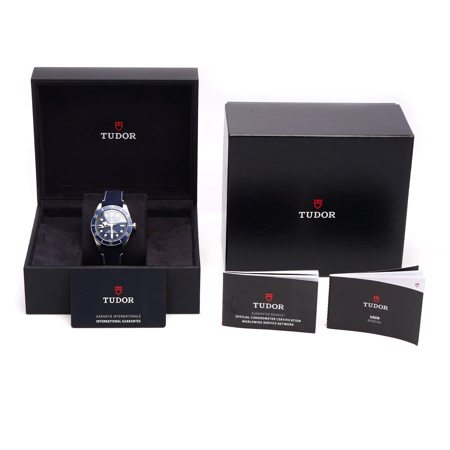 Tudor Geneve Chronometer wristwatch with navy blue dial, bezel and strap, with box and papers, on a white background