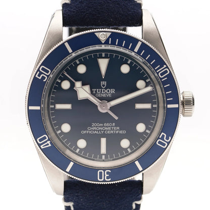 Tudor Geneve Chronometer wristwatch with navy blue dial, bezel and strap on a white background