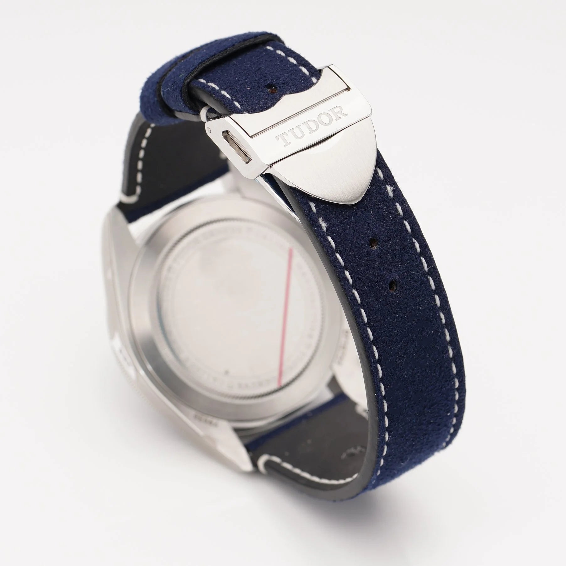 Tudor Geneve Chronometer wristwatch with navy blue dial, bezel and strap, still stickered, on a white background
