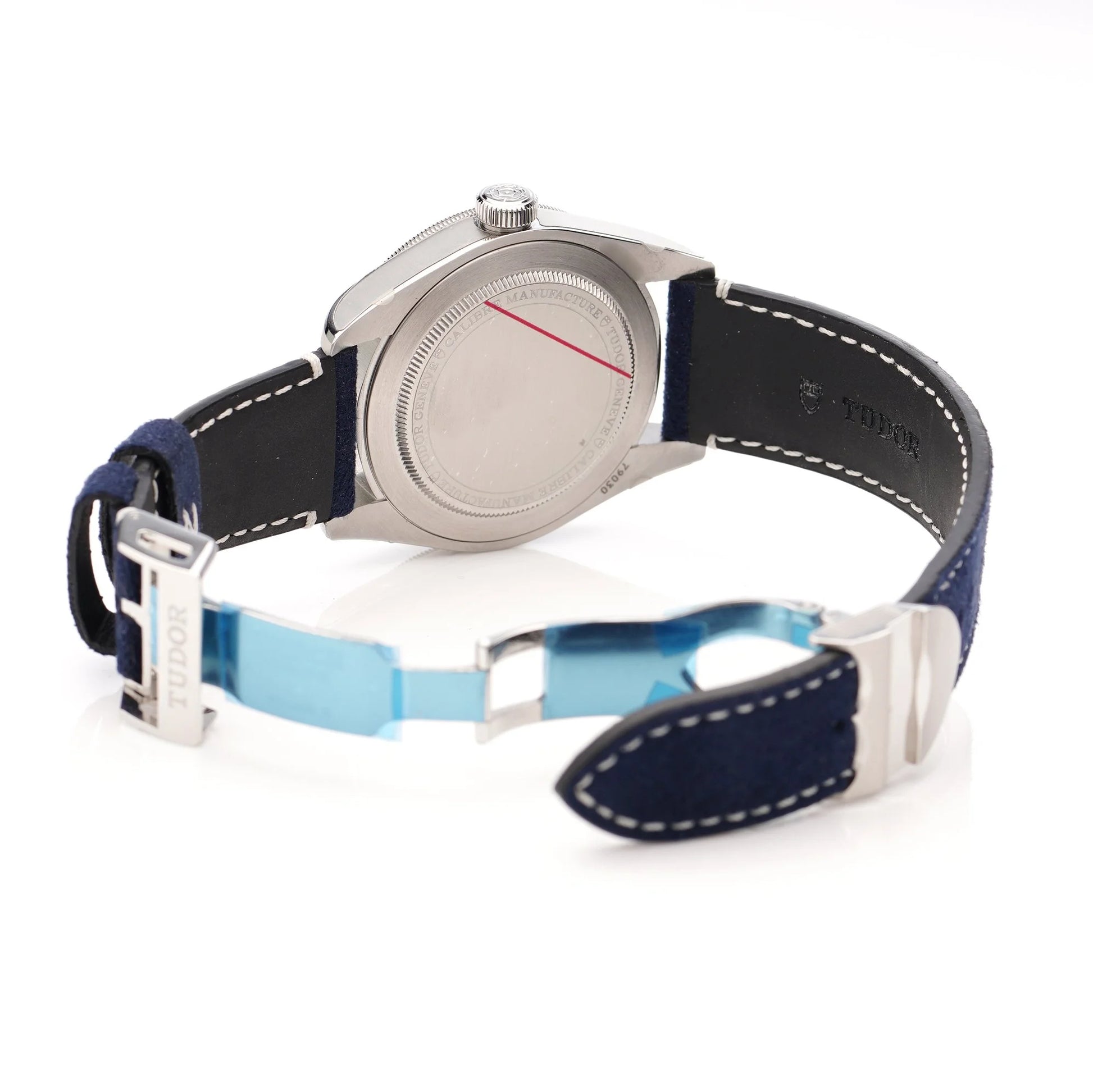 Tudor Geneve Chronometer wristwatch with navy blue dial, bezel and strap, still stickered, on a white background