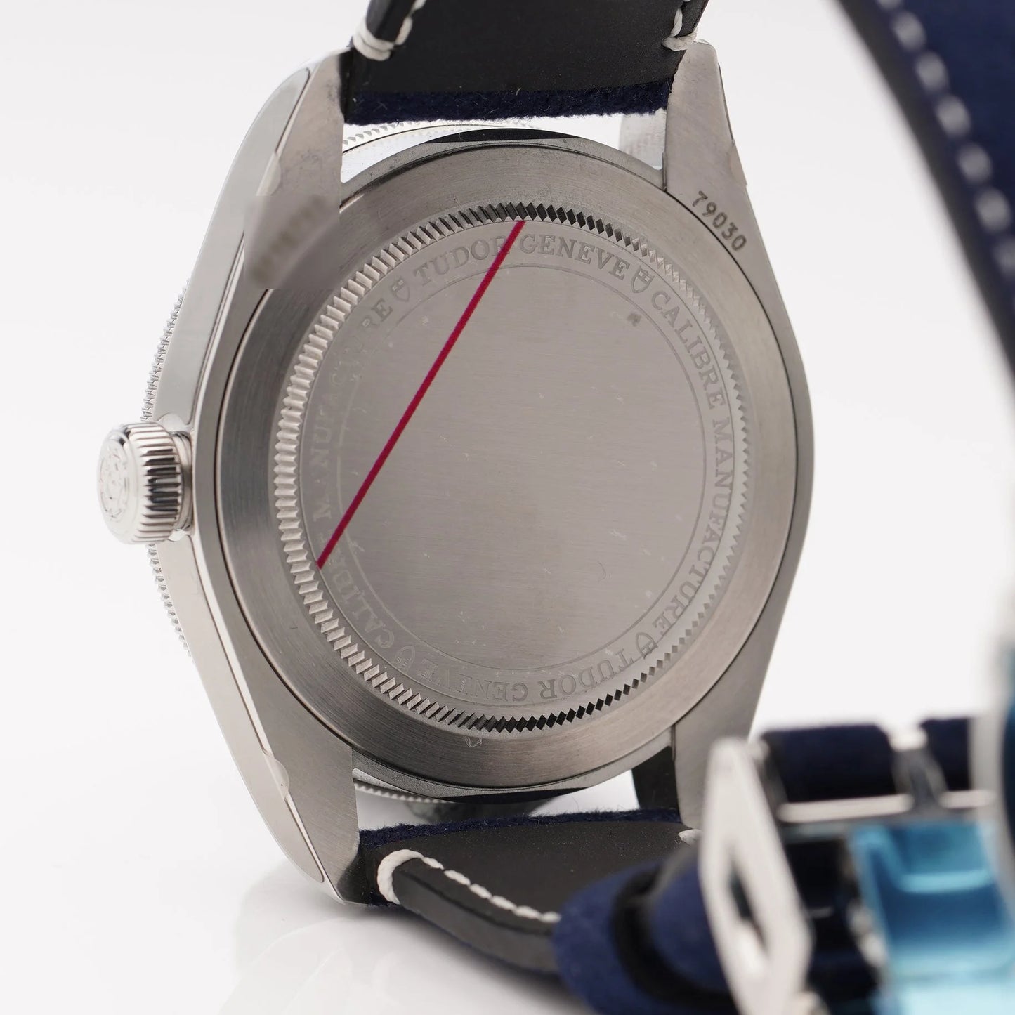 Tudor Geneve Chronometer wristwatch with navy blue dial, bezel and strap, still stickered, on a white background