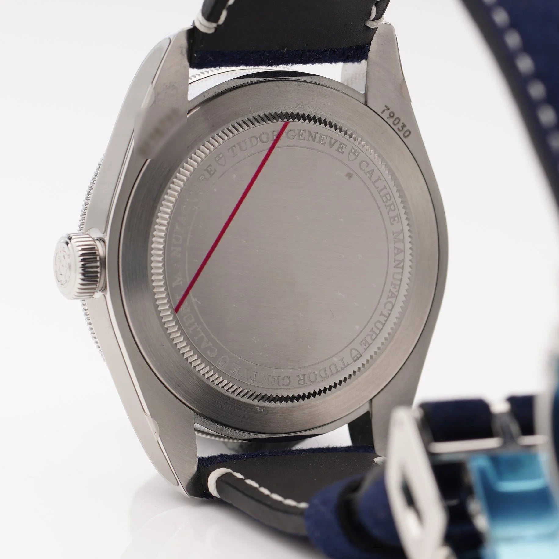Tudor Geneve Chronometer wristwatch with navy blue dial, bezel and strap, still stickered, on a white background
