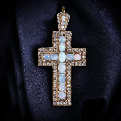 Antique 20 gold cross pendant set with diamonds and opals.