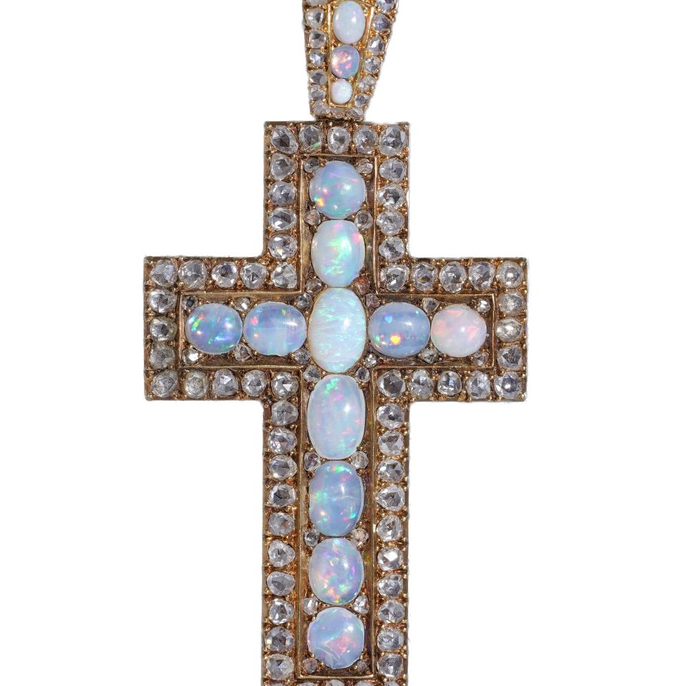 Antique 20 gold cross pendant set with diamonds and opals.