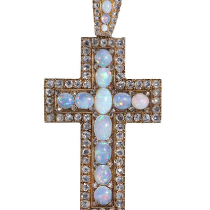 Antique 20 gold cross pendant set with diamonds and opals.