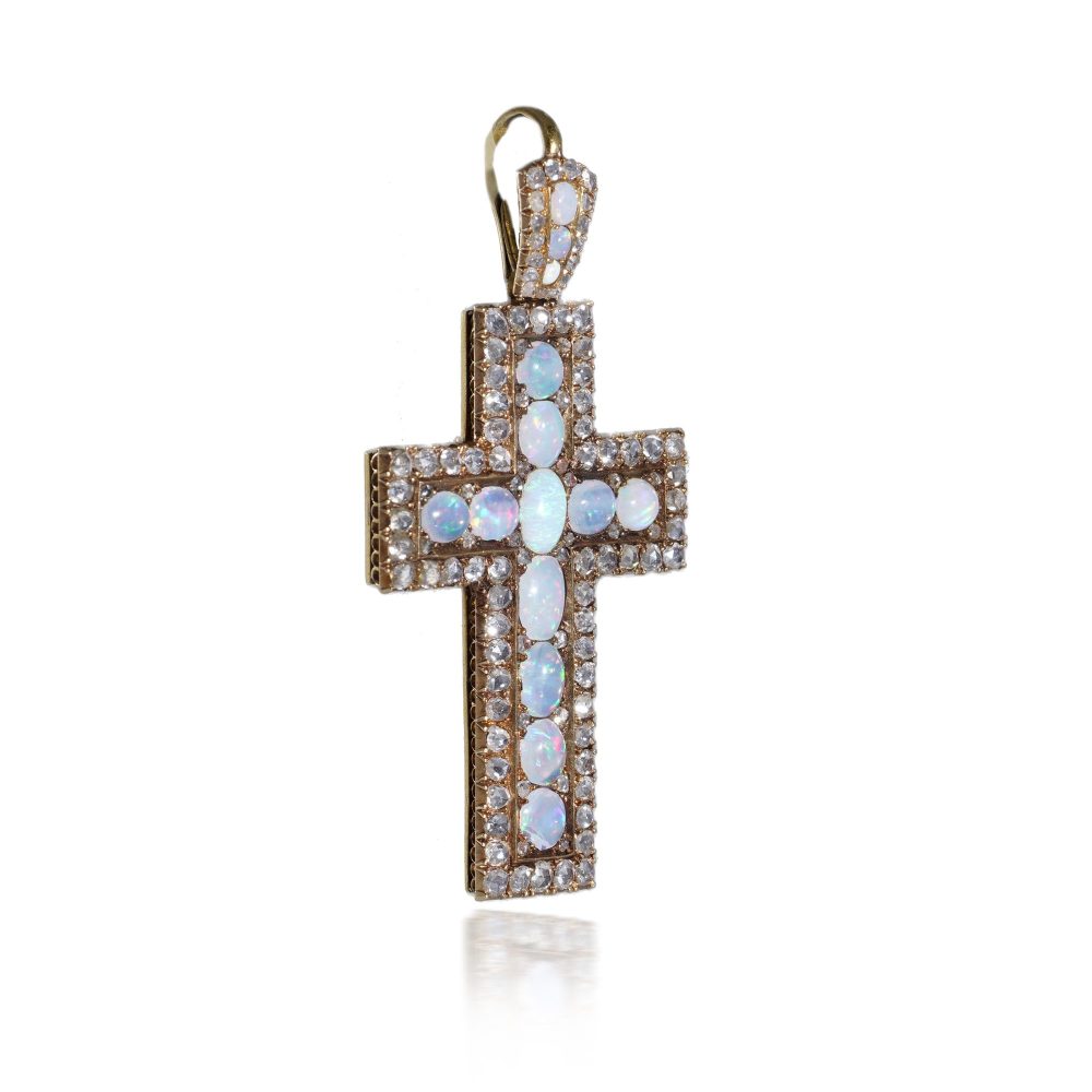 Antique 20 gold cross pendant set with diamonds and opals.