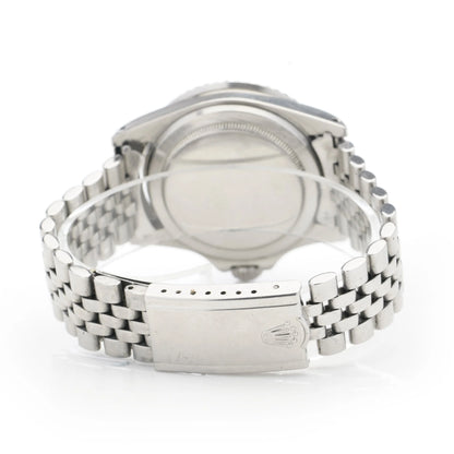 A Rolex Submariner wristwatch in stainless steel with a jubilee bracelet, on a white background