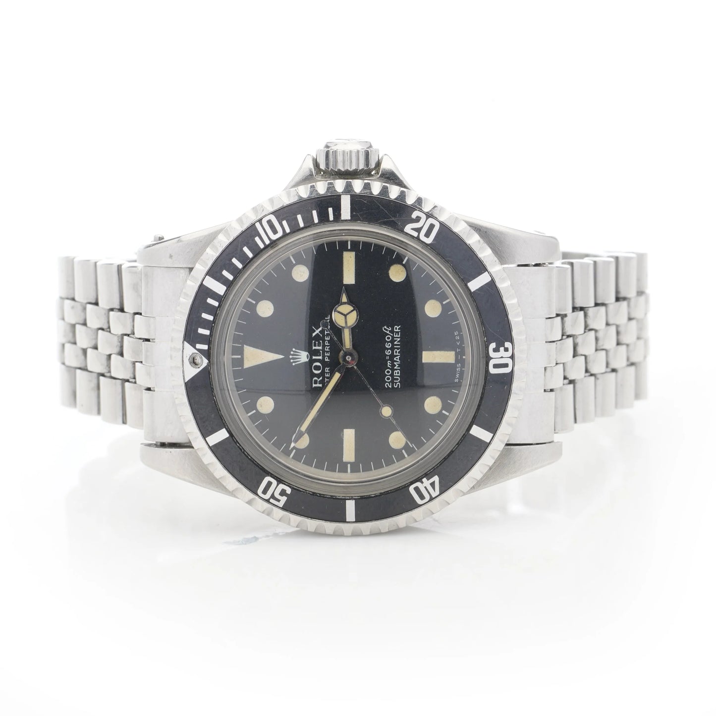 A Rolex Submariner wristwatch in stainless steel with a black dial and jubilee bracelet, on a white background