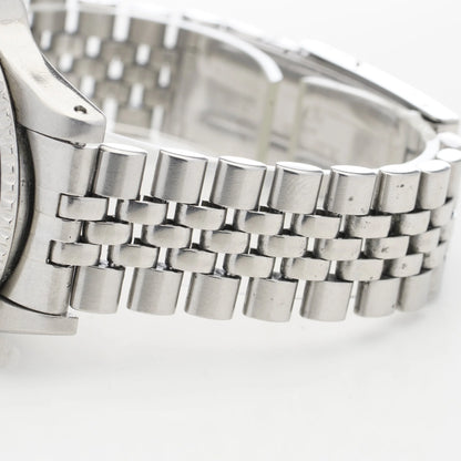 Close-up of a steel jubilee bracelet, on a white background