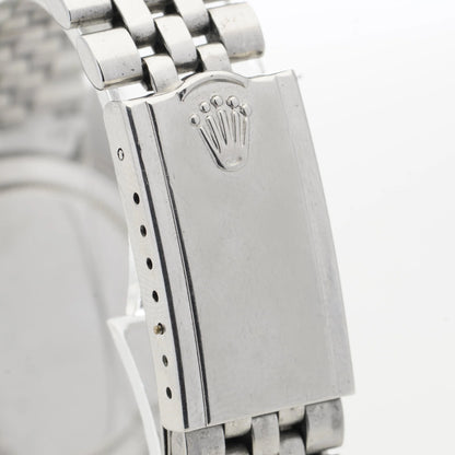 Close-up of a Rolex watch clasp, on a white background