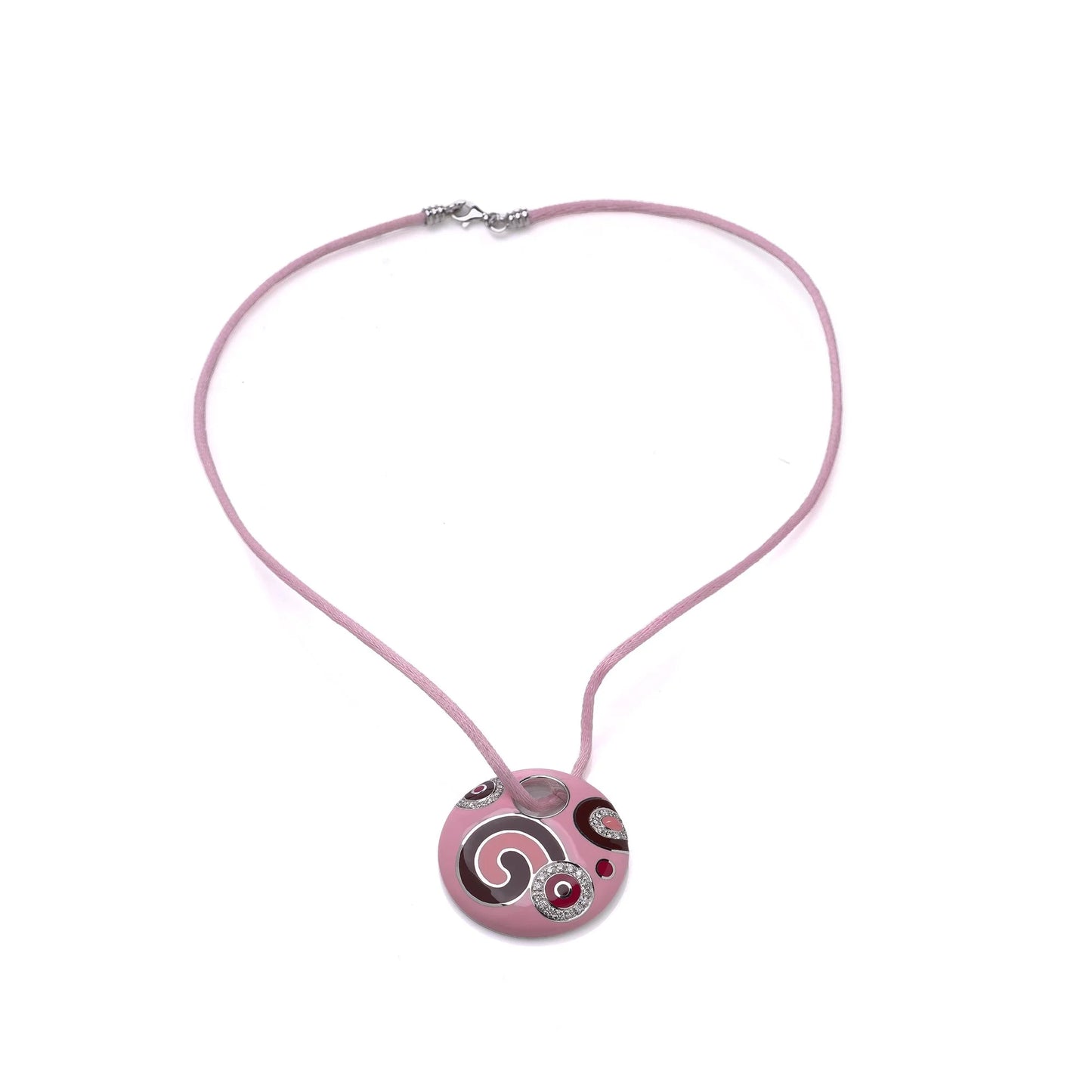A pink enamel circular pendant with diamonds on a pink cord, on a white background