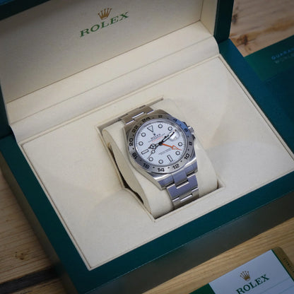 A Rolex Explorer II steel wristwatch with white dial, in a Rolex box