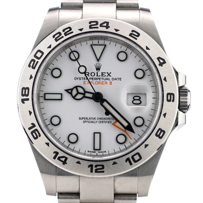 A Rolex Explorer II steel wristwatch with white dial, on a white background