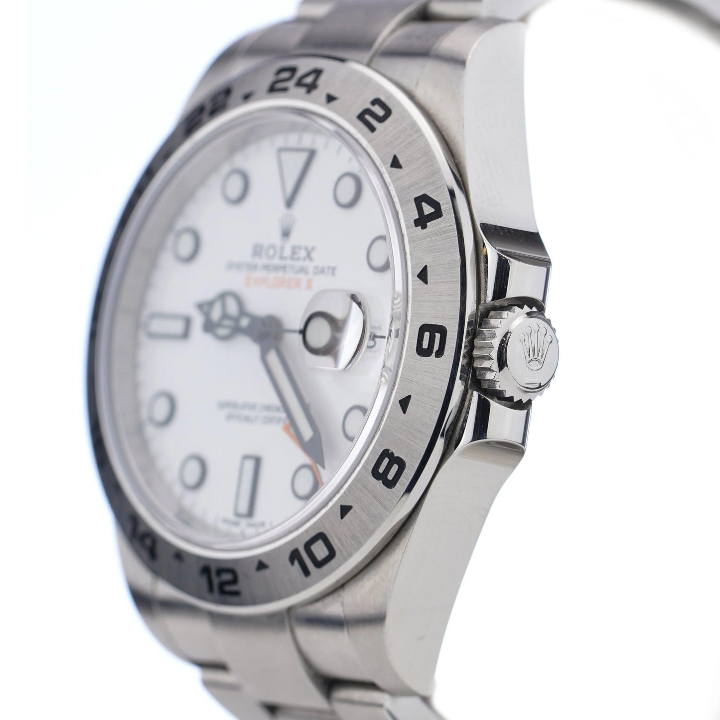 A Rolex Explorer II steel wristwatch with white dial, on a white background