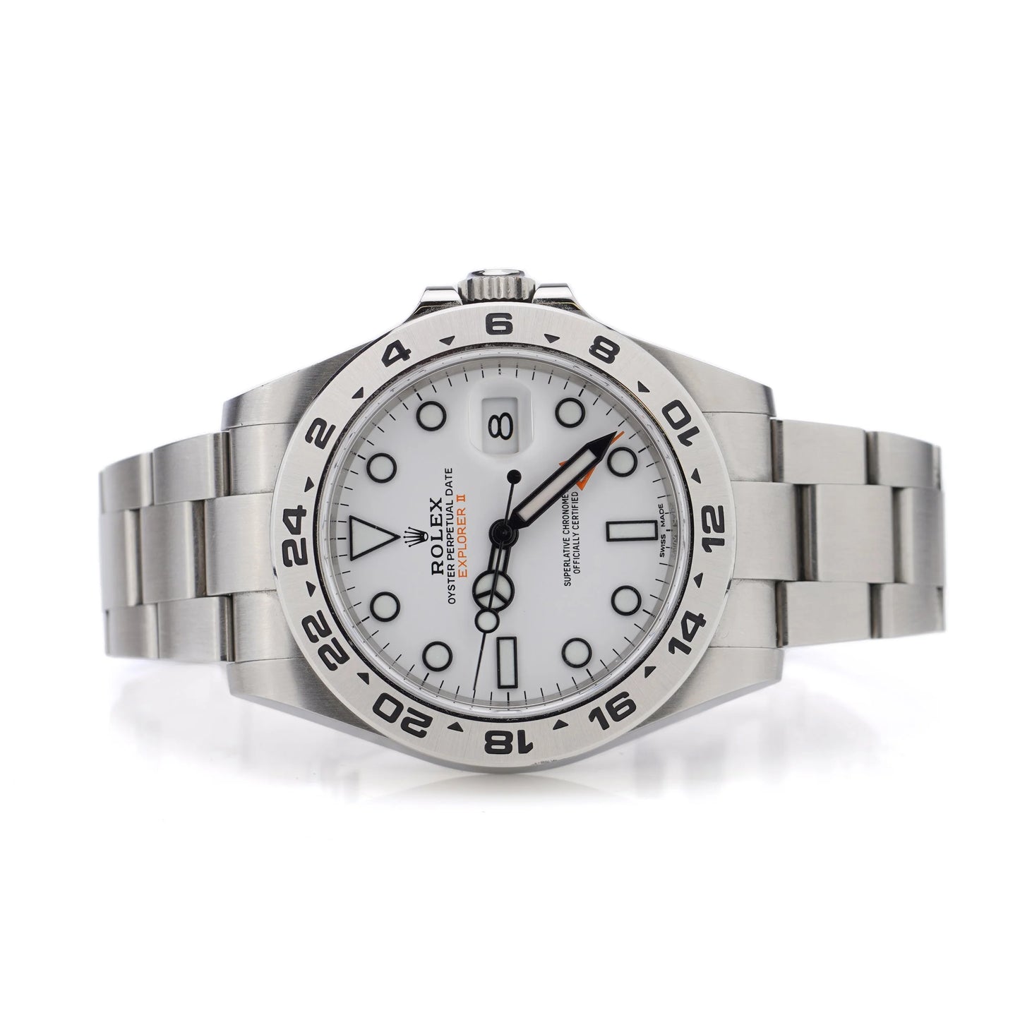 A Rolex Explorer II steel wristwatch with white dial, on a white background