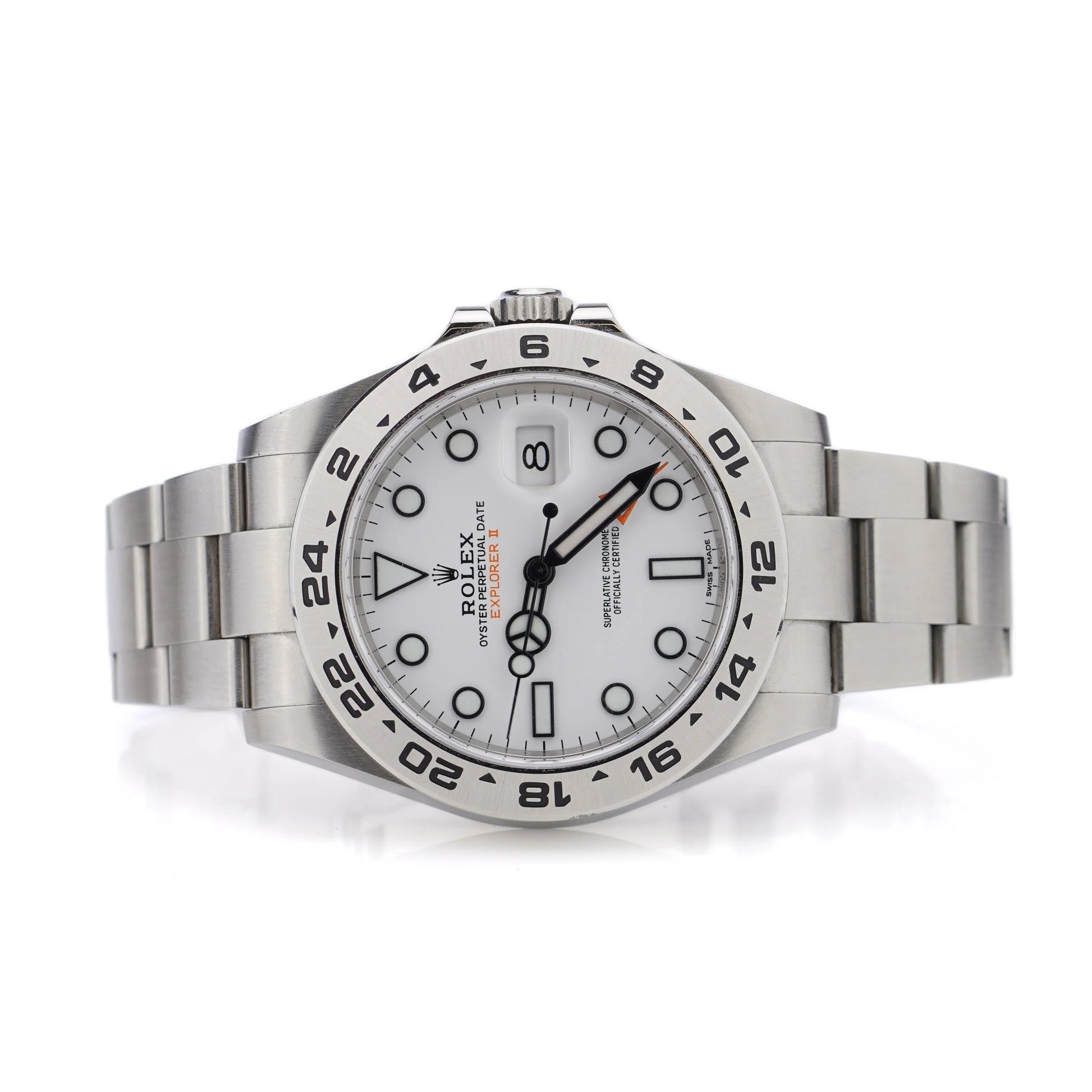 A Rolex Explorer II steel wristwatch with white dial, on a white background