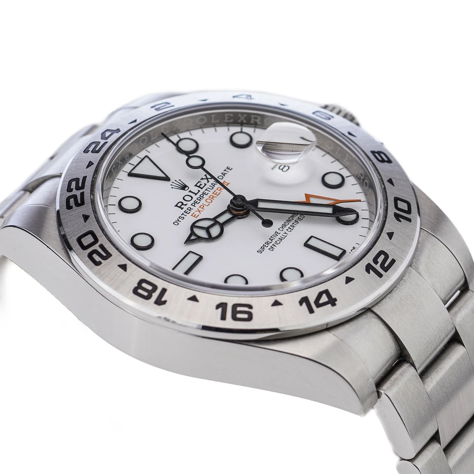 A Rolex Explorer II steel wristwatch with white dial, on a white background