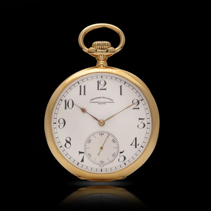 A yellow gold Vacheron & Constantin pocket watch with a white dial and black Arabic numbers, on a black background