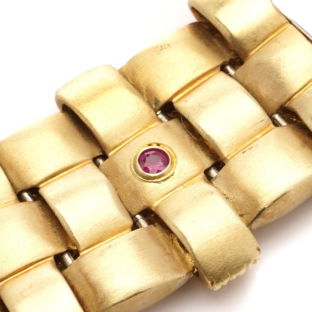 Woven design bracelet in white and yellow gold with diamonds and ruby,