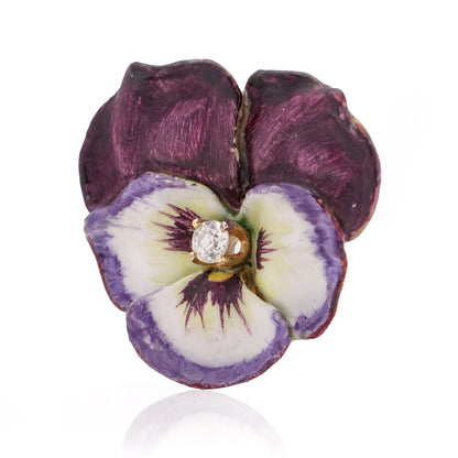 Gold flower brooch with enamel and an old-European cut diamond.