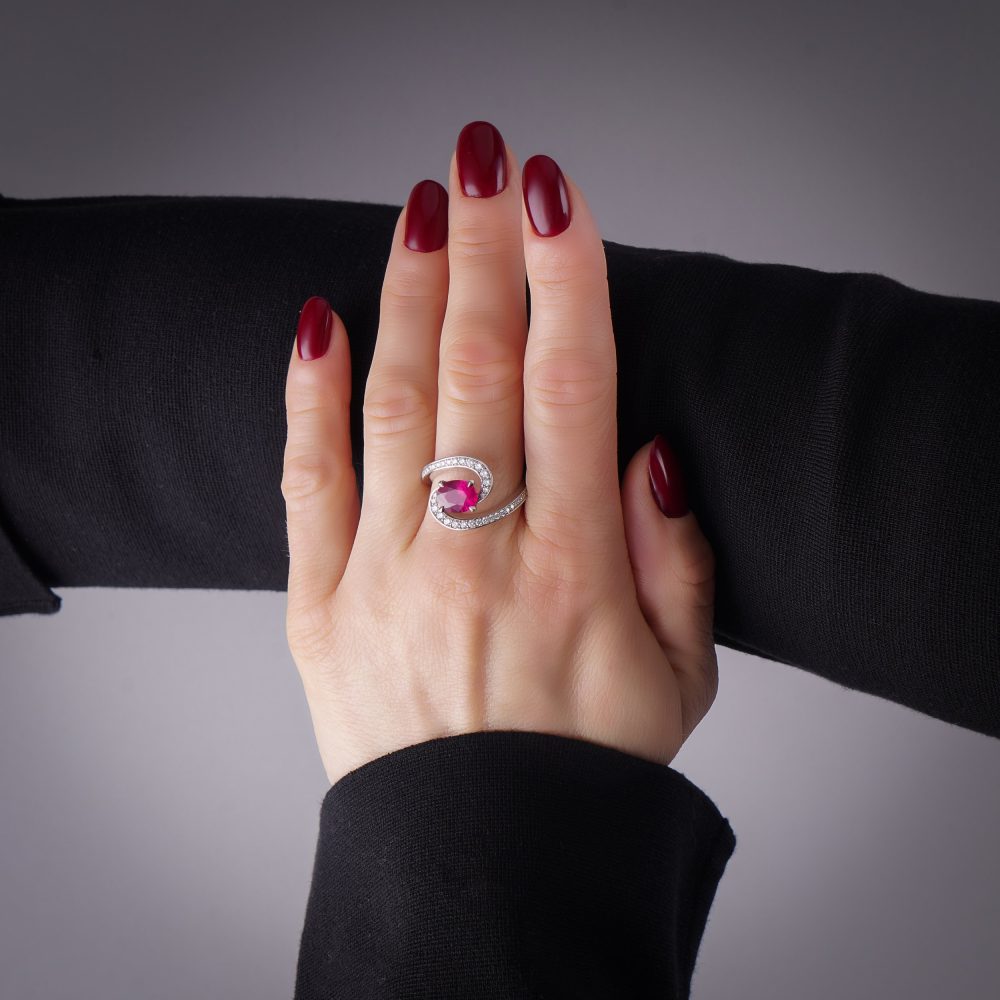 Vintage 1.20ct Ruby and Diamond Dress Ring, central 1.20ct oval red ruby surrounded by dynamic curve with pavé-set diamonds in platinum. Circa 1990s