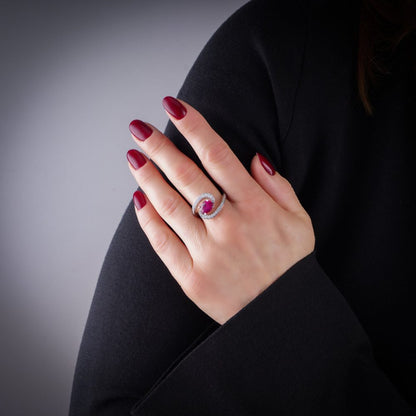 Vintage 1.20ct Ruby and Diamond Dress Ring, central 1.20ct oval red ruby surrounded by dynamic curve with pavé-set diamonds in platinum. Circa 1990s