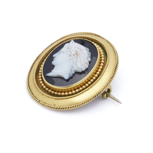Antique gold onyx cameo brooch.