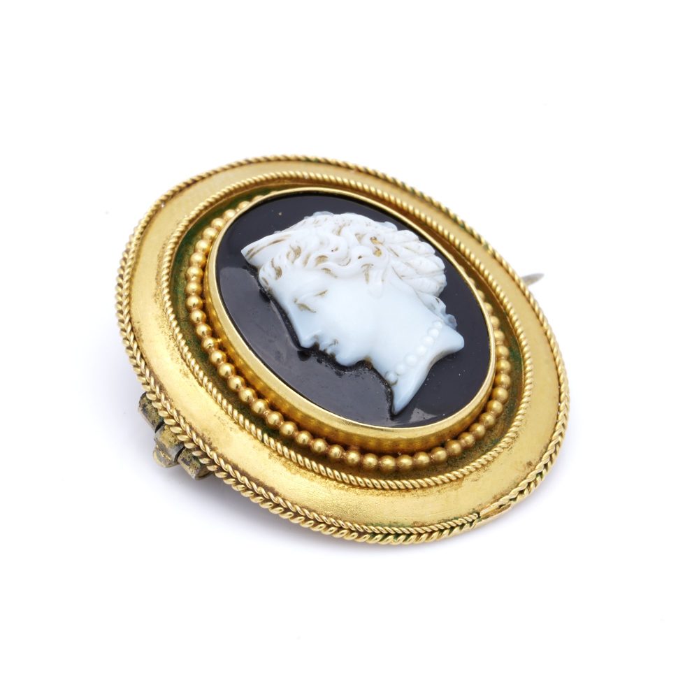 Antique gold onyx cameo brooch.