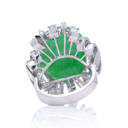 Vintage 23ct Natural Jadeite Jade and Diamond Cluster Ring, cabochon certified natural jade surrounded brilliant and baguette-cut diamonds in 14ct white gold. Circa 1970s