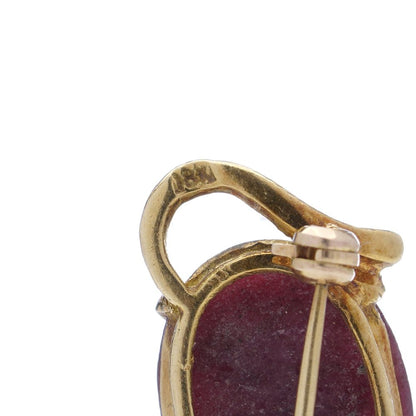 Vintage gold cat-shaped brooch with ruby eyes.